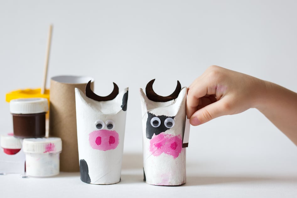 kid crafts bull from recycled materials. children's art. child create cow. diy