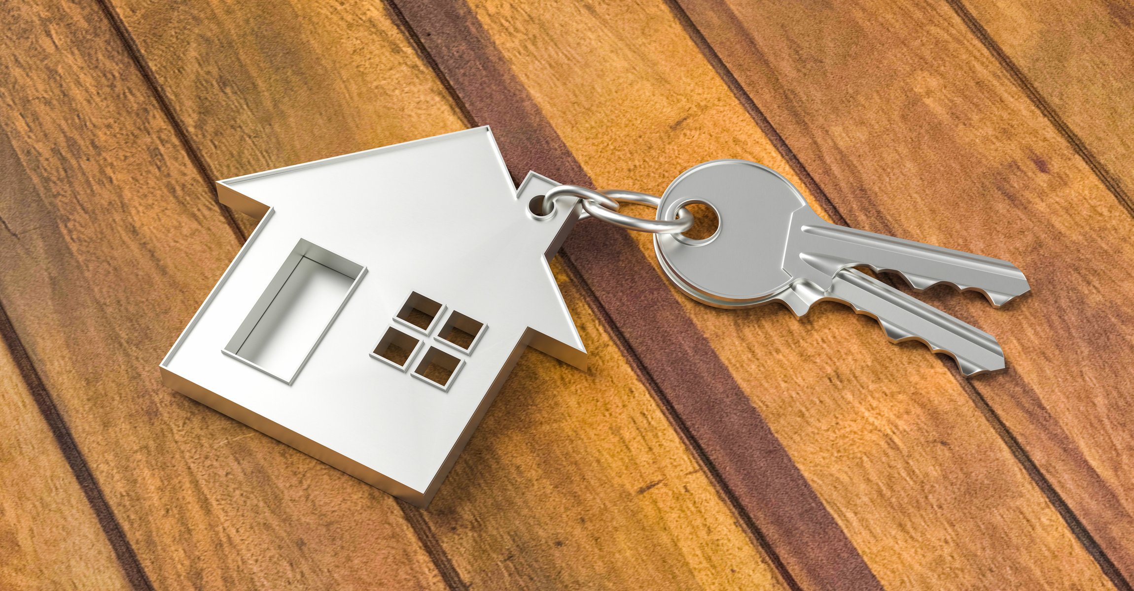 Keychain with Two House Keys on Wooden Table